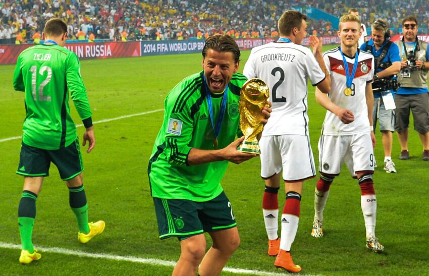 Rodri holding the FIFA World Cup trophy after Spain's victory