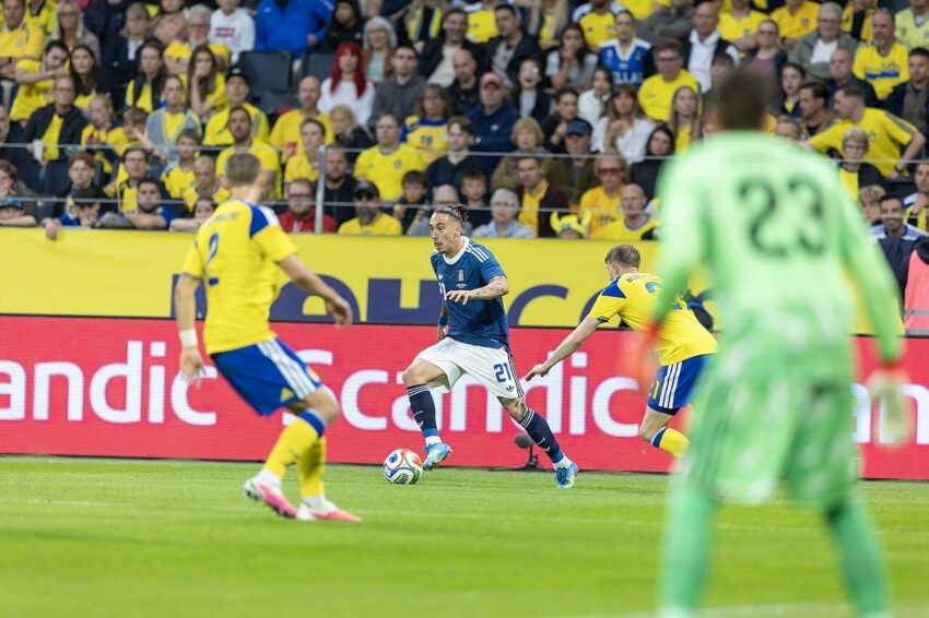 Kostas Tsimikas wearing Liverpool captain's armband during pre-season match