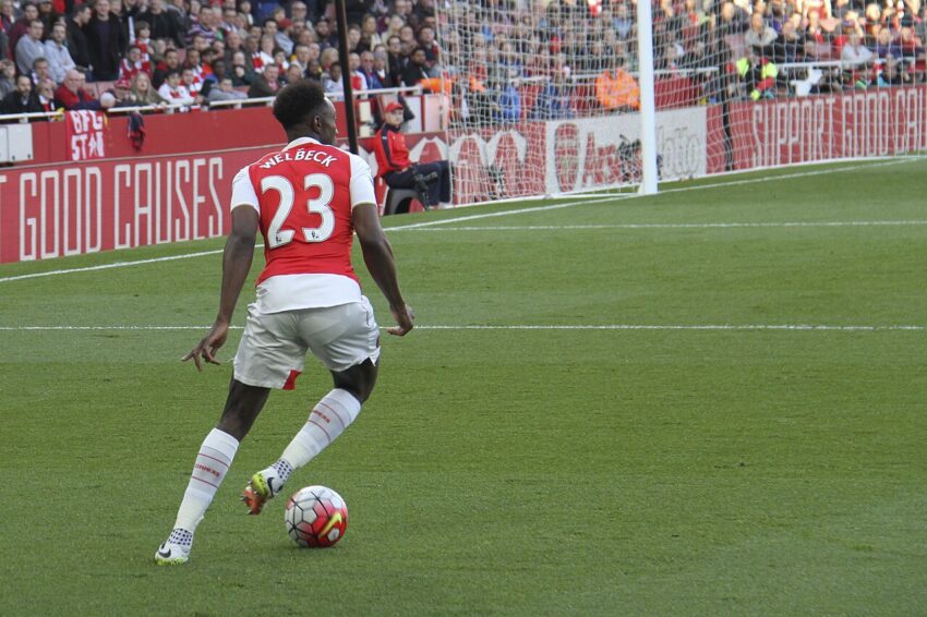Danny Welbeck in football kit during match action