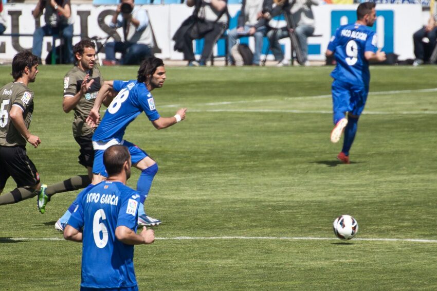 Getafe CF player in blue and white striped jersey